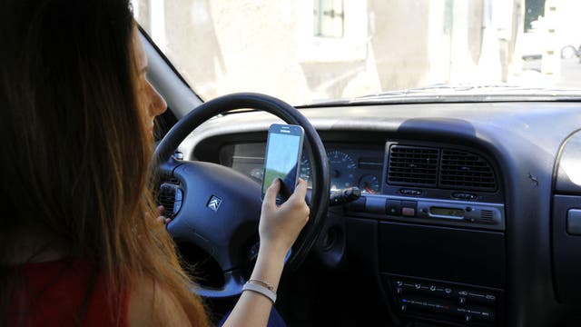 Holding a phone while driving will be illegal in Virginia starting January 1