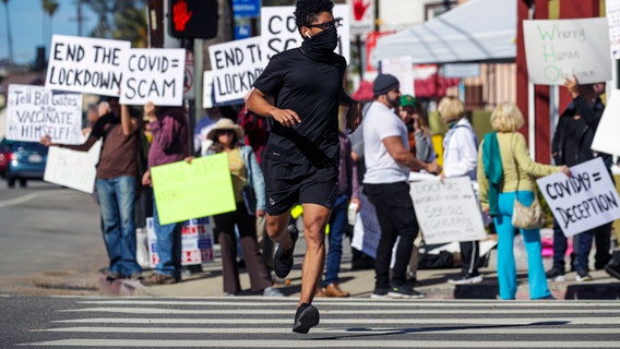 'Scamdemic' anti-vaccine protest shuts down Dodger Stadium vaccine site