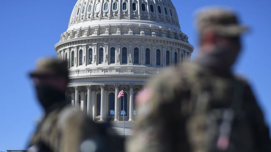 Members of the National Guard are seen patrolling near the U.S. Capitol Building on Capitol Hill on March 3, 2021, in Washington, D.C. (Photo by ERIC BARADAT/AFP via Getty Images)