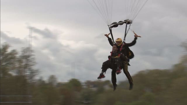 Loudoun County high school student with rare disorder parachutes onto Potomac Falls football field