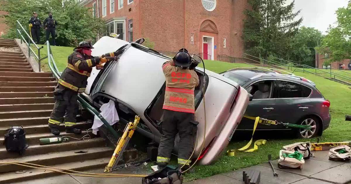 Video: DC firefighters saw off roof of car to rescue woman trapped ...