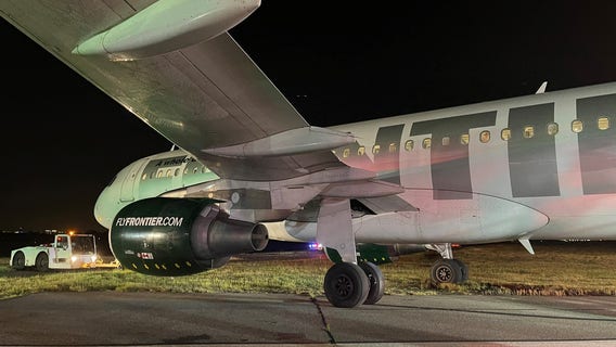 Plane slides off runway during landing at Reagan National Airport