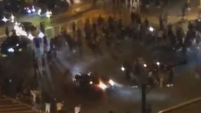 Car does donuts in downtown Silver Spring dangerously close to crowds blocking traffic, video shows