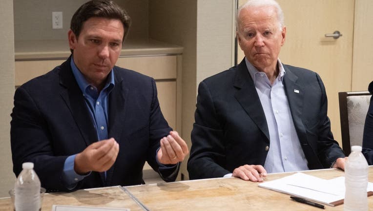 President Joe Biden alongside Florida Gov. Ron DeSantis (L) speaking about the collapse of the 12-story Champlain Towers South condo building in Surfside, during a briefing in Miami Beach, on July 1, 2021. (Photo by SAUL LOEB/AFP via Getty Images)