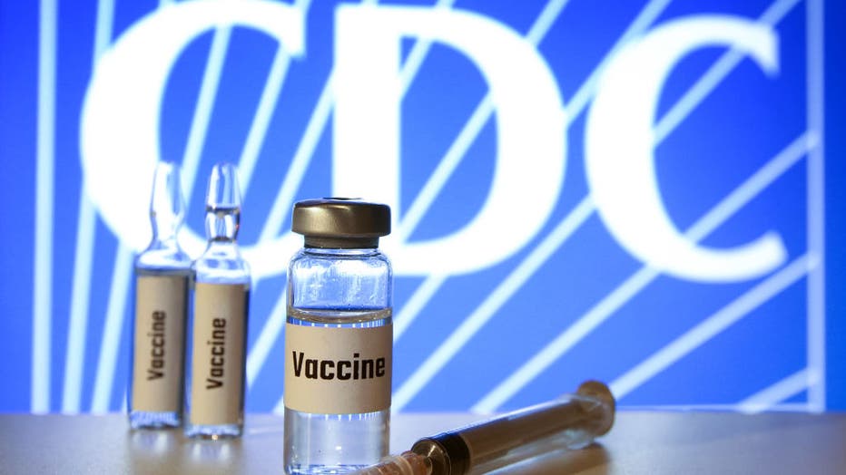 In this photo illustration, vials of fake 'Covid-19 Vaccine