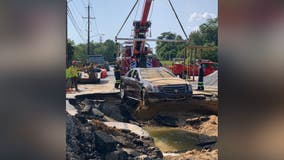 Vehicle that crashed into Prince George’s County sinkhole removed; crews still working on water-main