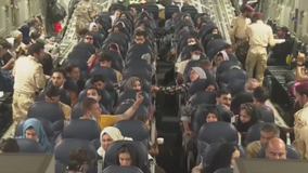 Afghan refugees share stories of survival as they arrive at Dulles Airport