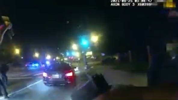 DC police body camera footage shows officer firing at vehicle in deadly shooting