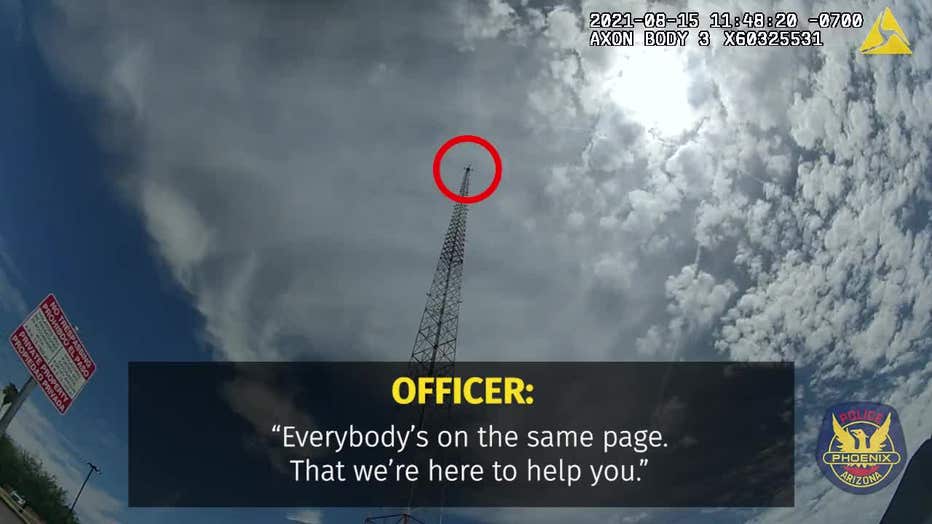 Phoenix Police officers talk down a man from a tower on Aug. 15