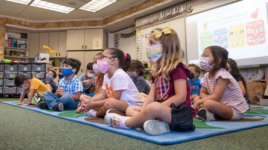 5a07561e-Elementary students return to class