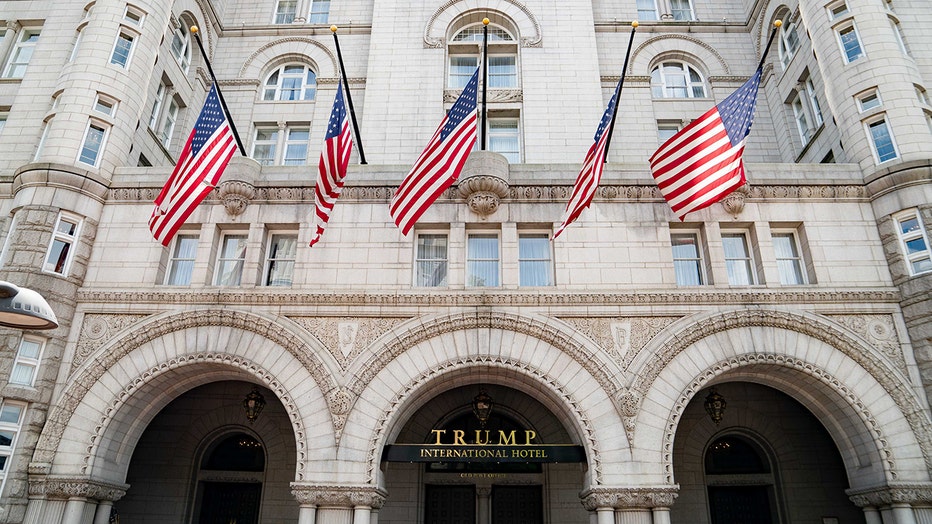 Face of Trump Hotel with 5 Americans flags