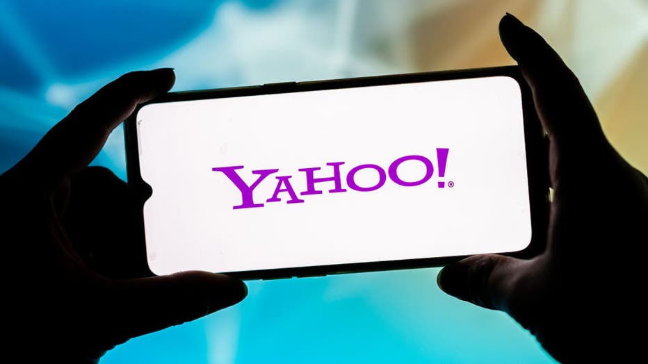 In this photo illustration, a Yahoo logo seen displayed on a