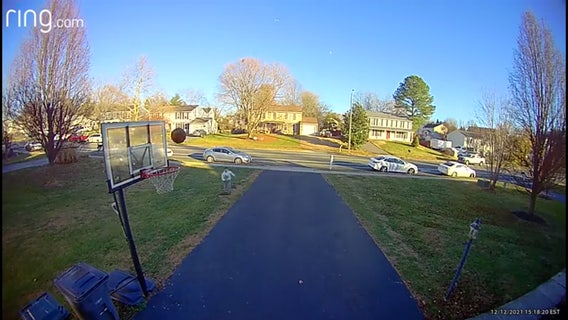 Kid's no-look, over-the-head shot caught on camera!