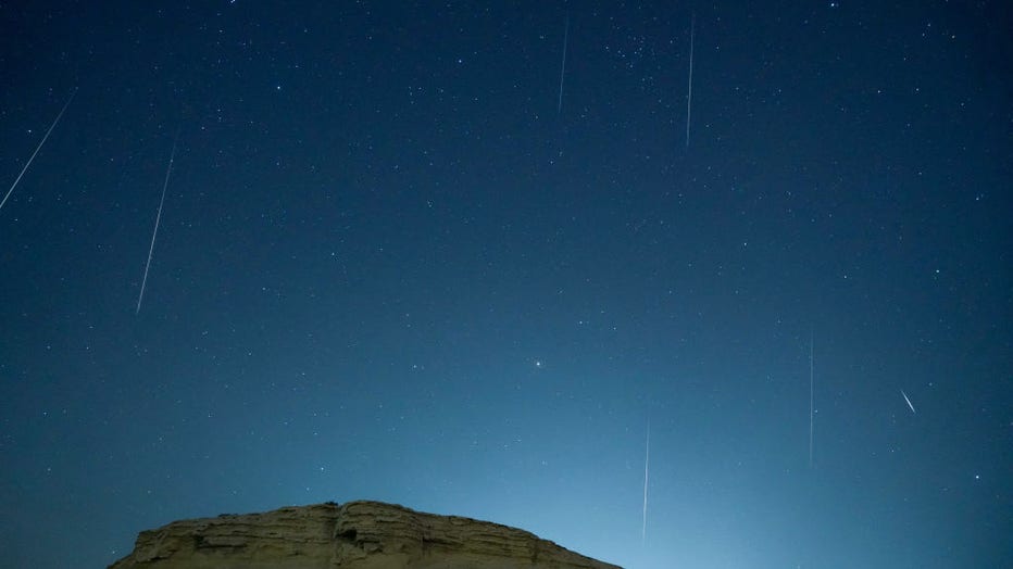 FILE - A meteor streaks across the night sky in Bazhou, Xinjiang Province, China, in the early morning of Dec. 14, 2021. (Photo credit: Xue Bing / Costfoto/Future Publishing via Getty Images)