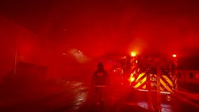 Crews investigate fire at Woodson High School in Fairfax