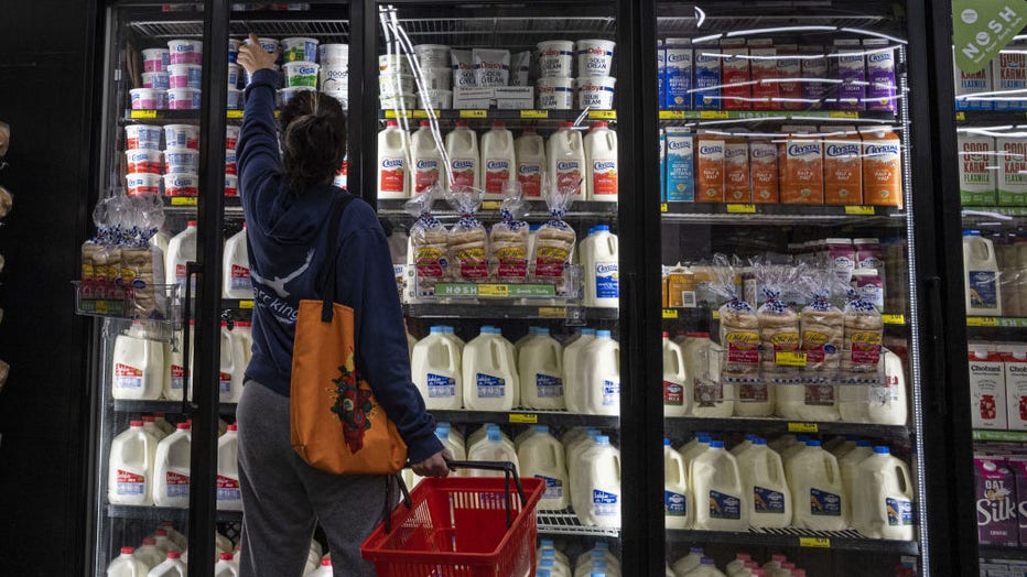 FILE IMAGE - A shopper reaches for cottage cheese inside a grocery store in San Francisco, California, on May 2, 2022. Photographer: David Paul Morris/Bloomberg via Getty Images