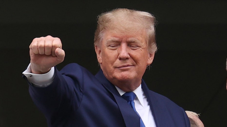 Former United States president Donald Trump acknowledges the fans from Millionaires Row before the148th running of the Kentucky Derby on May 7th, 2022, at Churchill Downs in Louisville, Kentucky. (Photo by Brian Spurlock/Icon Sportswire via Getty Images)