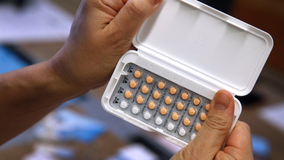 Dr. Sophia Yen, CEO and co-founder of Pandia Health, holds a one-months prescription of birth control pills at the health startup's office in Palo Alto, Calif. on Wednesday, June 5, 2019. Pandia offers online health consultations with doctors as well as