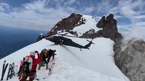 Watch: Helicopter balances atop narrow mountain ridge to rescue climber who fell 600 feet