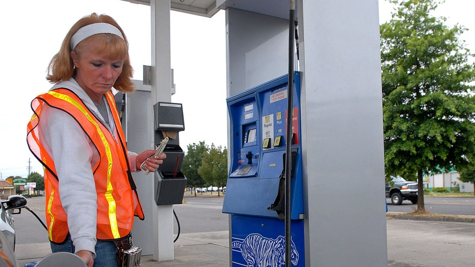 Station supervisor Stacy Windley, left, fuels a customer's c