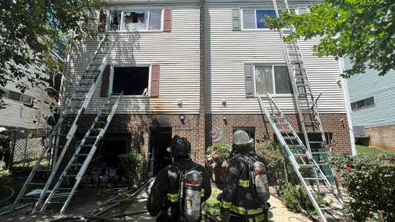 Teenager hospitalized after being rescued from duplex fire in DC