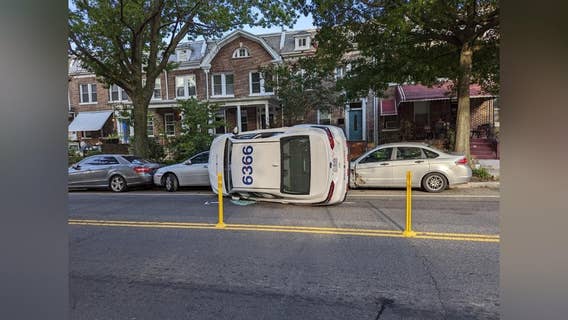 2 people hurt after MetroAccess vehicle hits parked cars then tips over