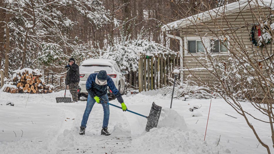 A man seen snow shoveling a driveway. Tappan got blanketed