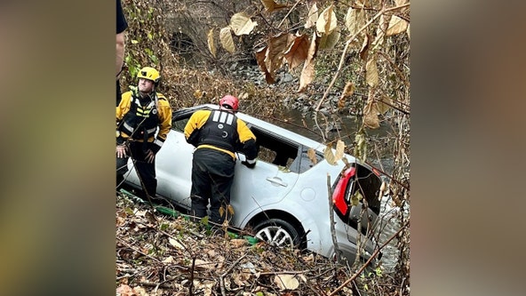 Driver pulled from vehicle that crashed off roadway above Rock Creek