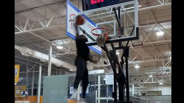 Former Harlem Globetrotter uses slam dunk for baby's gender reveal