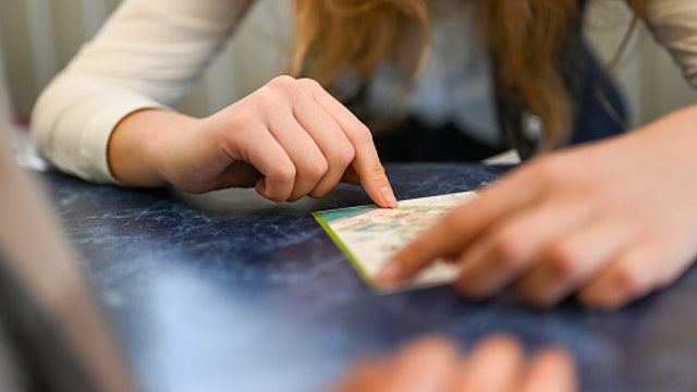 She closed her eyes and blindly picked lottery numbers. It worked.