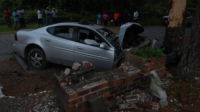 Driver killed after car goes airborne, crashes head-on into brick pillar in Virginia