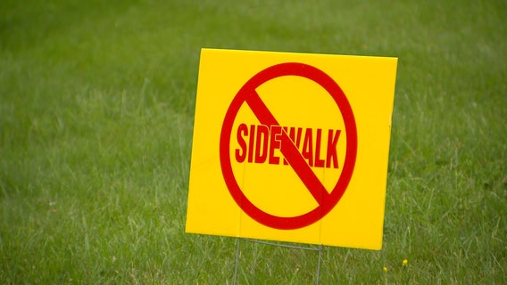 Residents rally on both sides after delays in Montgomery County sidewalk project