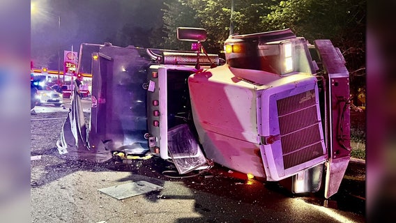 Dump truck overturns in DC; driver leaves scene