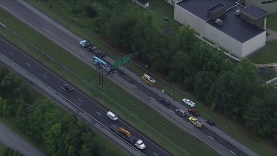 Delays on I-97 after vehicle strikes overhead highway sign