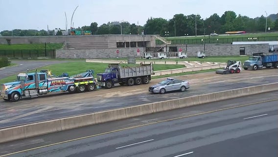 Overturned truck spills dirt on roadway causing delays in Arlington