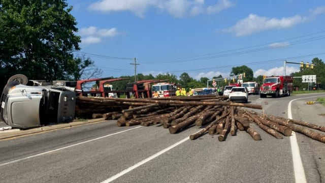 Tractor-trailer overturns, dumping logs onto highway in Virginia: police