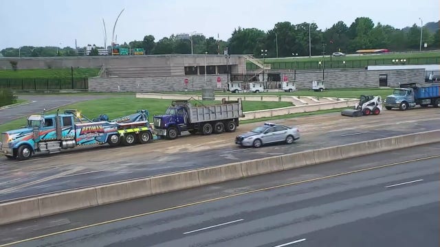 Overturned truck spills dirt on roadway causing delays in Arlington