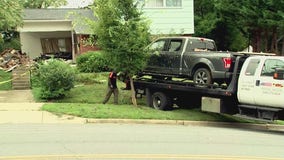 Vehicle crashes into Rockville home; downed power lines trap driver