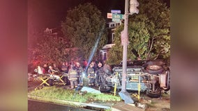 Driver trapped in vehicle that overturned after crashing into traffic pole in DC