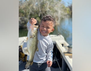 Viral video captures 6-year-old catching 8lb fish while his father erupts  with pride and joy