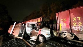 Train strikes tow truck stuck on tracks in Forest Glen, officials say