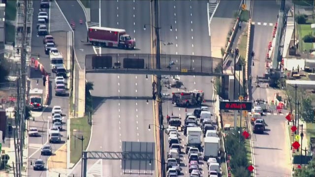 DC pedestrian bridge over I-295 struck by load on passing vehicle; structure being evaluated