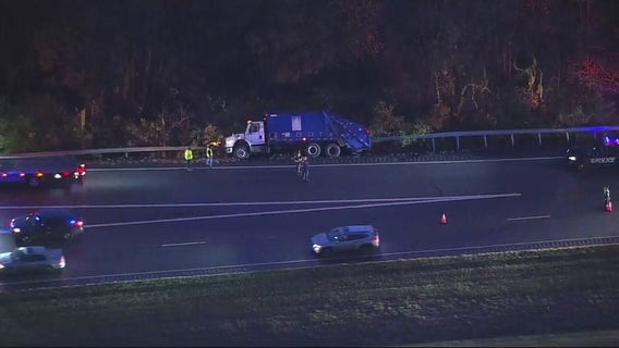 Delays after trash truck overturns in Glen Burnie