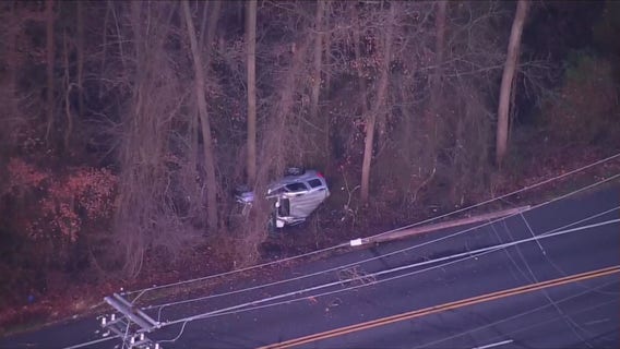 Vehicle crashes into wooded area, overturns in Beltsville