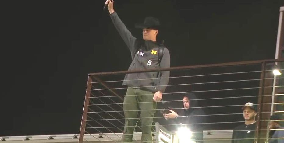 Watch: National champion Michigan football team returns home from Houston