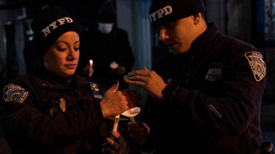 NYPD-officers-candlelight-vigil.jpg