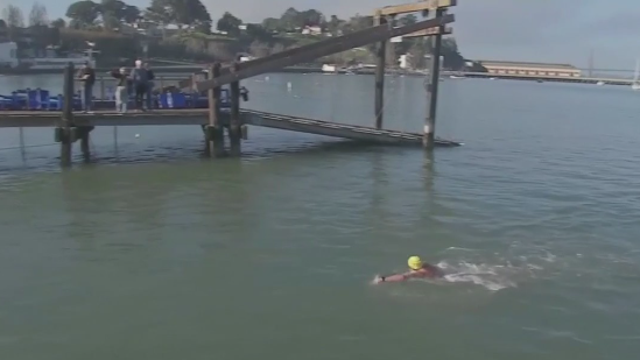 Hundreds jump into the Potomac River to raise awareness about climate change