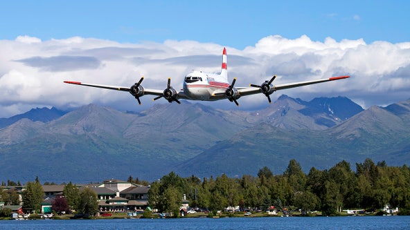 Vintage Douglas C-54 plane with 2 people on board crashes into Alaska riverbank