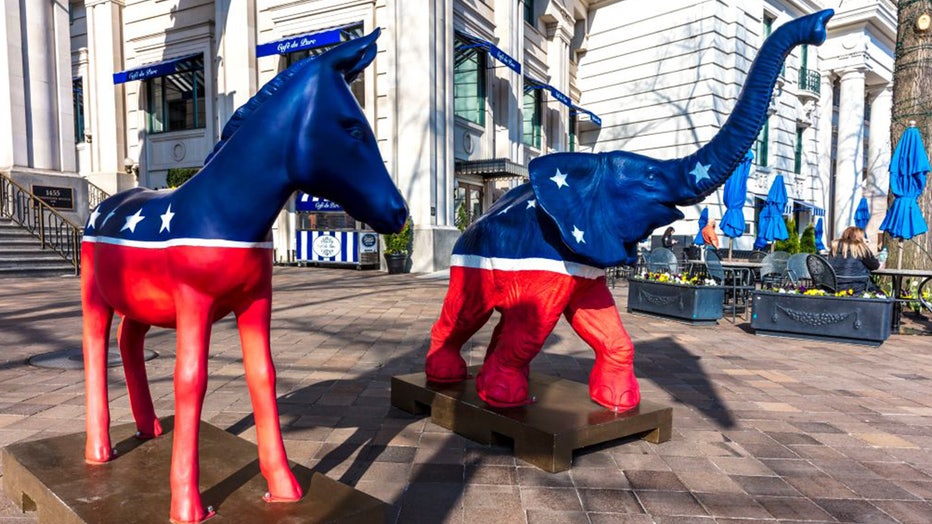 democratic and republican logo statues side by side