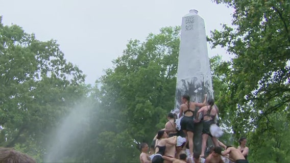 Herndon Monument climb tradition marks end of plebes first year at Naval Academy